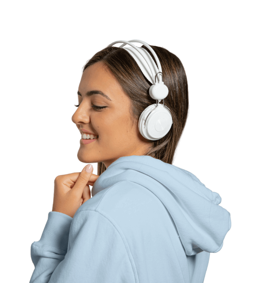 Woman listening to music with wireless headphones